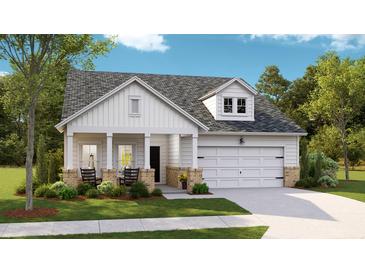 Charming single-Gathering home with a covered porch, lush lawn, and attached two car garage at 1024 Sagegrass St, Summerville, SC 29485