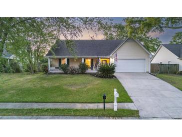 Charming single-story home with attached garage, manicured lawn, and inviting front porch at 109 Red Cypress Dr, Goose Creek, SC 29445