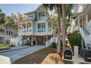 Inviting two-story beach house with double porches and beautiful landscaping at 1637 Folly Creek Way # E-12, Charleston, SC 29412