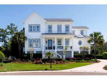 Charming two-story home with landscaped yard, inviting front porch, and a classic white exterior with gray trim at 1905 Lone Oak Pt, Mount Pleasant, SC 29466