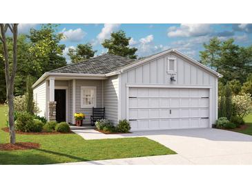 Charming single-Gathering home with a well-manicured lawn, classic siding and a two car garage at 323 Pine Crest View Dr, Summerville, SC 29486