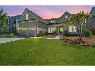 Charming home with a two-car garage, manicured lawn, and inviting front porch at 521 Yellow Tower Ter, Charleston, SC 29412