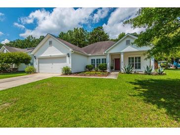 Charming one-story home with a well-kept lawn and convenient two-car garage at 107 Towering Pine Dr, Ladson, SC 29456