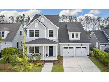 Charming two-story home featuring a welcoming front porch and a two-car garage at 361 Ripple Park Dr, Summerville, SC 29486
