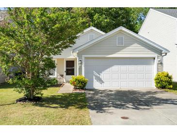 Charming home featuring a two-car garage, well-kept lawn, and lovely curb appeal at 3802 Annapolis Way, Ladson, SC 29456