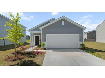 Charming single-story home with a two-car garage and manicured front yard at 483 Pender Woods Dr, Summerville, SC 29486