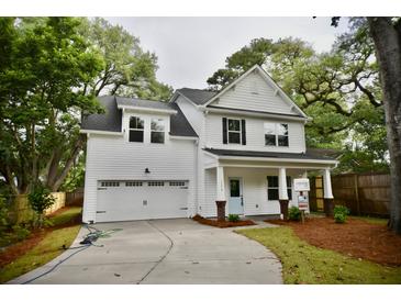 Charming two-story home with a light blue front door and a manicured front lawn at 1178 Braddock Ave, North Charleston, SC 29406