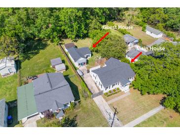 Aerial view showcasing both the main house and the guest house nestled amongst lush greenery at 1324 Maxwell St, North Charleston, SC 29405