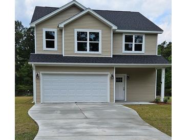 Charming two-story home with a front-facing garage, neutral siding, and well-manicured lawn at 1518 Stanwick Dr, Johns Island, SC 29455