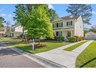 Charming two-story home with a well-manicured lawn and a paved driveway at 8956 N Red Maple Cir, Summerville, SC 29485