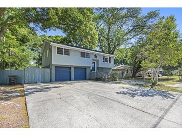 Charming two-story home features a two-car garage and a spacious concrete driveway at 14 Newark Ave, Goose Creek, SC 29445