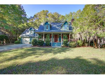 Charming two-story home featuring a spacious front porch and well-manicured lawn at 1417 Pine Island View, Mount Pleasant, SC 29464