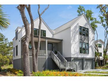 Beautiful two-story home with a modern design and inviting front porch at 2138 Boatwright Rd, Johns Island, SC 29455