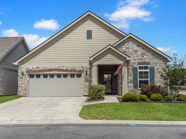 Charming single-story home featuring stone accents, a two-car garage, and well-maintained landscaping at 222 Stone Village Cir, Summerville, SC 29486