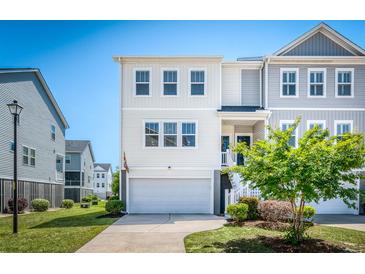Charming two-story home with a well-manicured lawn and a two-car garage at 571 Mclernon, Johns Island, SC 29455