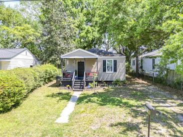 Charming single-story home featuring a cozy front porch and well-maintained lawn at 2125 Victory Ave, North Charleston, SC 29405