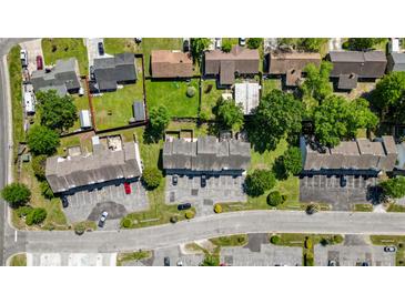 An aerial view shows a townhouse complex with assigned parking and partial tree coverage at 259 Pine Shadow Dr, Goose Creek, SC 29445