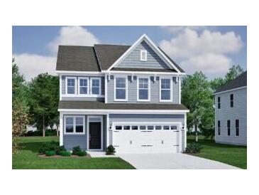 Charming two-story home features a classic design and a pristine white garage door at 555 O'Leary Cir, Summerville, SC 29483
