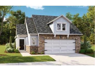 Charming two-story home featuring stone accents, a two-car garage, and a well-maintained lawn at 1022 Sagegrass St, Summerville, SC 29485