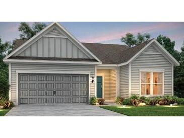 Charming one-story home with a two-car garage, traditional siding, and well-maintained landscaping at 1175 Island Preserve Rd, Johns Island, SC 29455