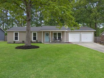 Charming single-story home featuring a well-manicured lawn, a two-car garage, and a welcoming light blue front door at 166 Braly Dr, Summerville, SC 29485