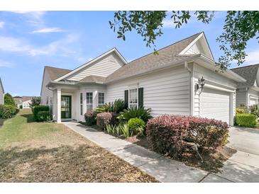 Charming home with manicured landscaping, a covered entrance, and attached two car garage at 170 Sea Lavender Ln, Summerville, SC 29486