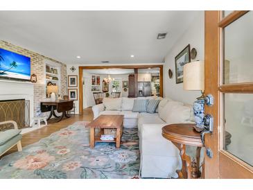 Inviting living room features a comfortable sectional sofa and warm, inviting decor, perfect for relaxing and entertaining guests at 356 Hobcaw Dr, Mount Pleasant, SC 29464