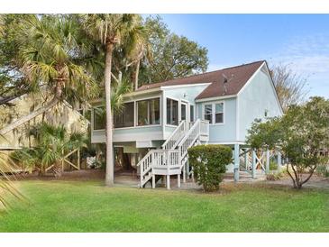 Charming coastal home featuring a screened porch, elevated design, and lush landscaping at 507 Cobby Creek Ln, Seabrook Island, SC 29455