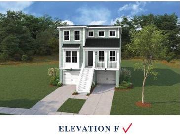 Charming two-story home with a welcoming staircase, double garages and pleasant green exterior at 752 Minton Rd, Charleston, SC 29412