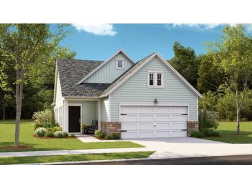 Charming single-Gathering home featuring a two-car garage, stone accents, and lush landscaping at 1017 Sagegrass St, Summerville, SC 29485