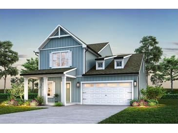 Charming new construction with a covered porch, garage, and landscaped yard at 1034 Marsh Harrier Dr # Cc3-4-3, Ravenel, SC 29470