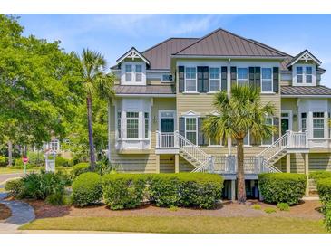 Charming townhome featuring a private entrance, well-manicured landscaping, and a light, neutral color palette at 1650 Long Grove Dr, Mount Pleasant, SC 29464
