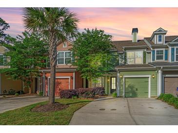 Charming townhomes with colorful exteriors, attached garages, and well-maintained landscaping at 1823 Chauncys Ct, Mount Pleasant, SC 29466