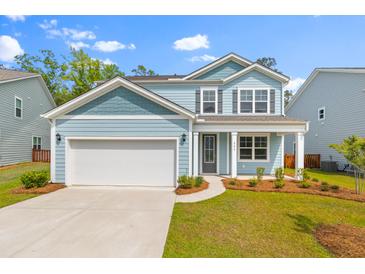 Charming two-story home with a well-manicured lawn and attached two-car garage at 208 Cherry Grove Dr, Summerville, SC 29483