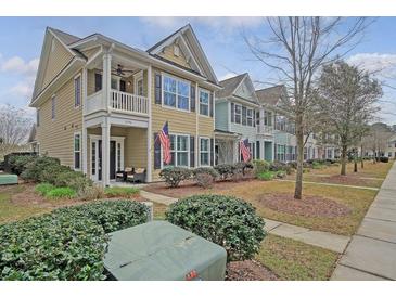 Charming townhomes feature front porches, upper balconies, and well-maintained landscaping at 2096 Promenade Ct, Mount Pleasant, SC 29466