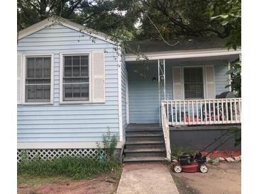 Charming one-story home with light blue siding and white-trimmed windows at 2666 Bennett Yard Rd, North Charleston, SC 29405