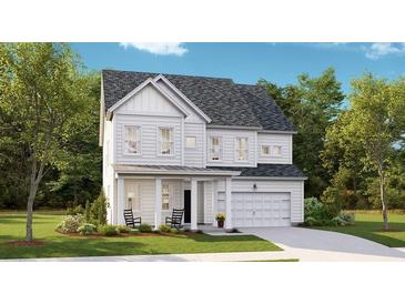 Charming two-story home with a covered front porch and well-manicured lawn at 540 Richfield Way, Summerville, SC 29486