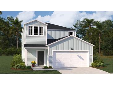 Charming two-story home with a light blue exterior, two-car garage, and a neatly landscaped front yard at 325 Pine Crest View, Summerville, SC 29486