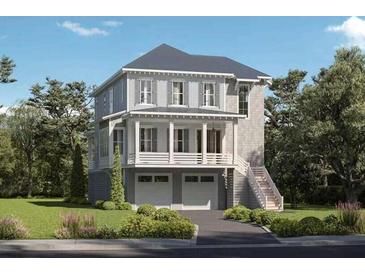 Charming two-story home with a covered porch, two car garage, and beautifully landscaped front yard at 347 Simone Dr, Daniel Island, SC 29492