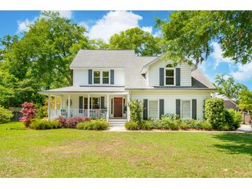 Charming two-story home with a welcoming front porch and beautifully landscaped front yard at 679 Clearview Dr, Charleston, SC 29412