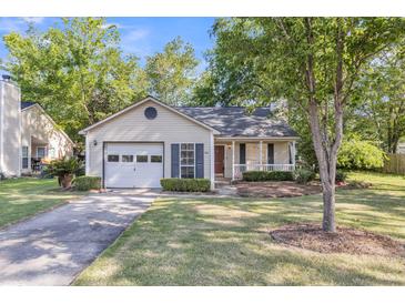 Charming one-story home with a garage, front porch, and well-maintained lawn at 153 Corsair St, Summerville, SC 29483