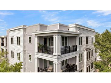 Beautiful condominium with open air balconies and black metal railings, offering amazing outdoor living at 200 River Landing Dr # D310, Charleston, SC 29492