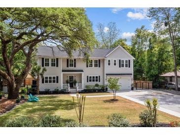 Charming two-story home featuring a well-maintained lawn and traditional architectural details at 2159 Parkway Dr, Charleston, SC 29412