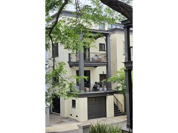 Charming three-story home with multiple balconies and garage access, perfect for city living at 22A Corinne St # 31, Charleston, SC 29403