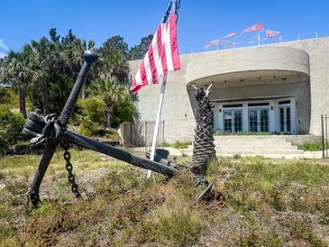 View of a structure with an anchor and flag in front at 3030 Brownell, Sullivans Island, SC 29482