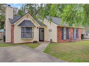 Charming single-Gathering home with brick accents, black shutters, and a well-manicured lawn at 1019 Tj Ln, Summerville, SC 29486