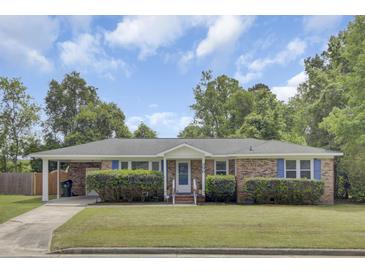 Charming brick ranch with blue shutters, mature landscaping and a covered parking area at 296 Oxford Rd, Ladson, SC 29456