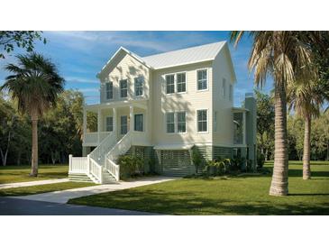 Charming two-story home with a inviting front porch and well-manicured lawn, perfect for Southern living at 3997 Chantey Crest, Johns Island, SC 29455