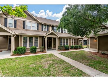 Charming townhome exterior with manicured lawn and inviting entrance at 5514 Colonial Chatsworth Cir, North Charleston, SC 29418