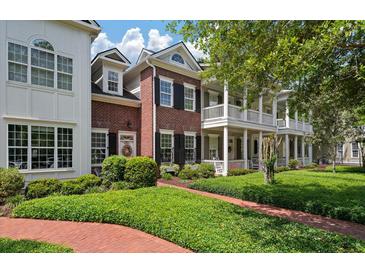 Charming two-story brick home with double porches, black shutters, and professionally landscaped yard at 1781 Tennyson # 6, Mount Pleasant, SC 29466